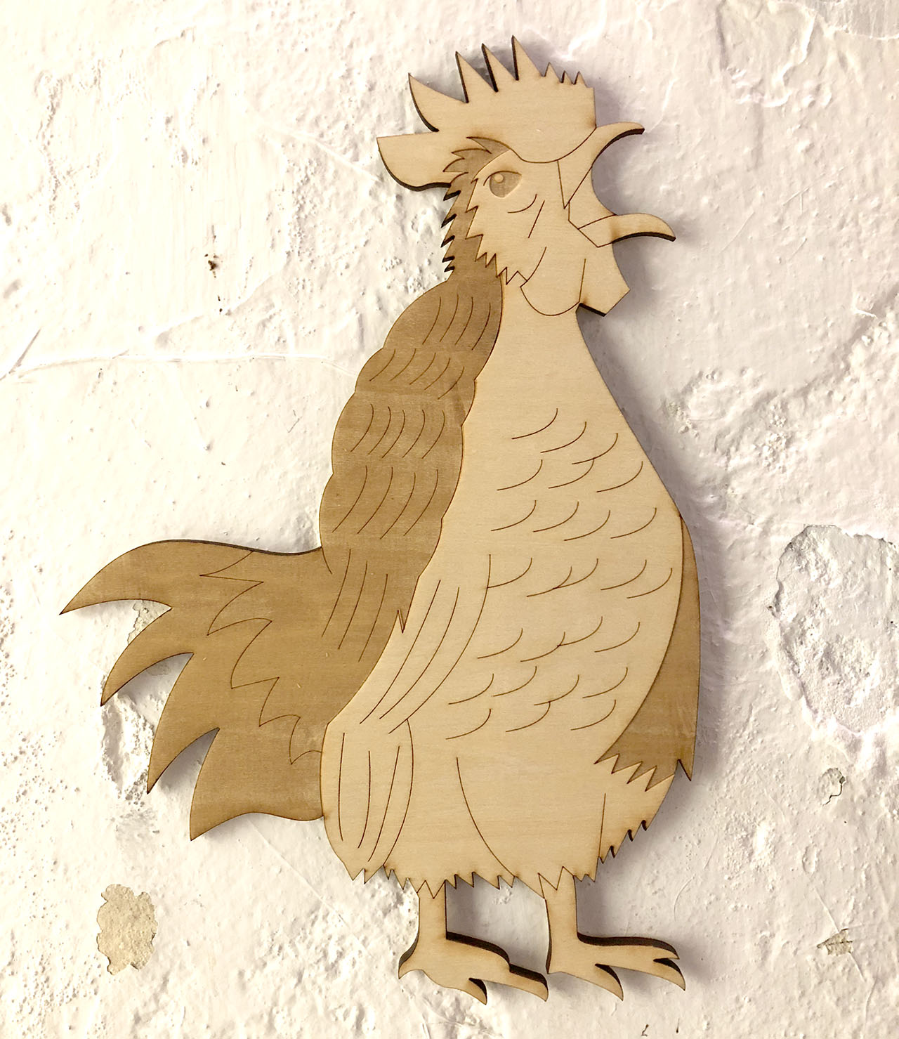 Rooster wood cutout on white wall