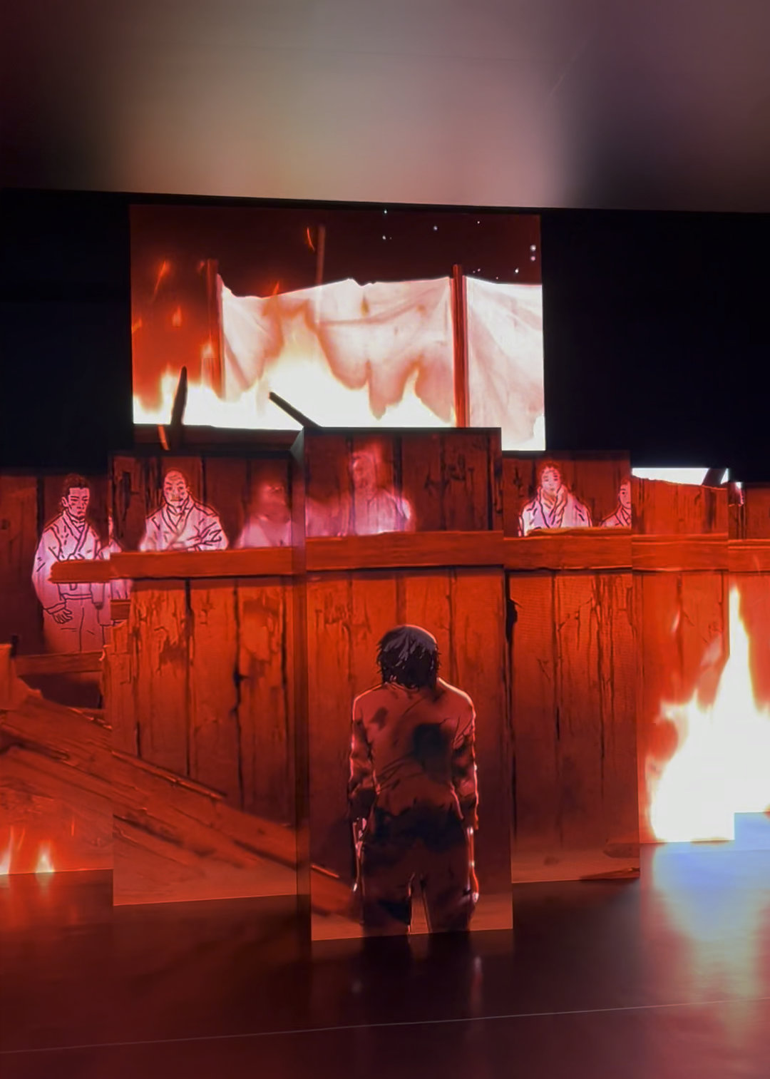 A multi-screen animation with an illustrated, haggard man standing in front of some fiery background